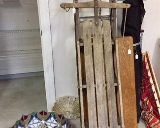 Vintage sled - is that a Tiffany lamp shade on the floor?  Maybe you better come find out...