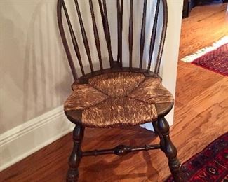 One of a pair of rush-seated Windsor chairs