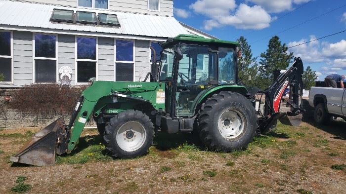 Tracker $16,000 OBO.  Has original paperwork.  New was $32,000.00 One owner.   Backhoe $7500.00 OBO 