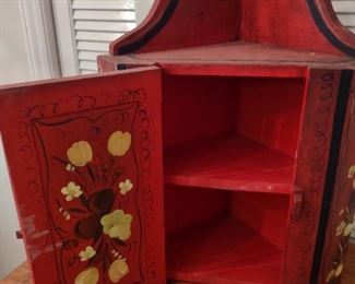 Charming red painted corner cupboard