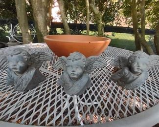 Concrete cherubs; clay pot