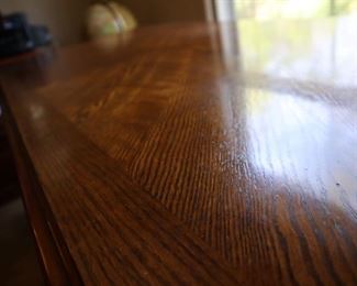 Wood grain top of desk. 