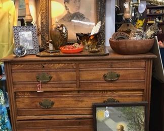 Oak chest of drawers, religious art, antique family photos