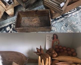 Lots of wooden boxes, conch shells, wooden bowls and crockery 