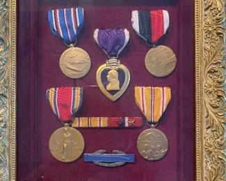 A collection 6 world war 2 metals in a framed including the Purple Heart