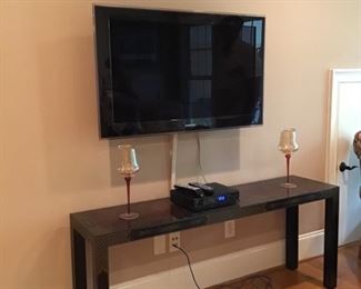 Very nice Asian inspired sofa table and flat screen TV.  (TV will be on a stand not on the wall Mount)