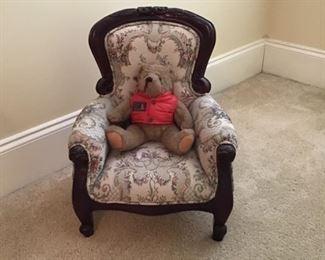 Mr. bear is sitting in this absolutely adorable upholstered children’s chair.