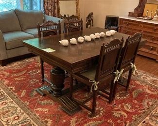 Lovely Antique European refectory oak table with pristine parquet top. It sits on a Karastan "Ashara" rug that is approximately 8' x 12' 