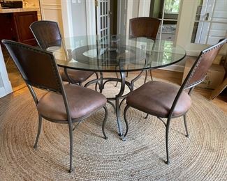 54" Round Glass Top Pedestal Dining Table with 6 Chairs (leather and metal seats). Photo 1 of 2