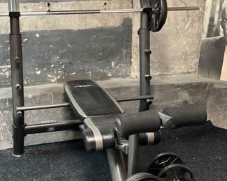 Weight-lifting bench with weights. 