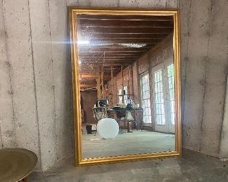 Two extra large gold framed beveled mirrors