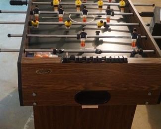 Foosball table attached to entertainment unit