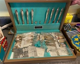 Set of silverware in silverware chest