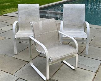 (3pc) PATIO CHAIRS, BROWN JORDAN | Including an armchair by Brown Jordan with black and white woven seat (h. 32 x w. 24-1/2 x d. 27-1/2 in.), and a pair of armchairs with white woven seats (h. 38-1/4 x w. 24 x d. 28 in. each) [chairs with some wear from outdoor use] 