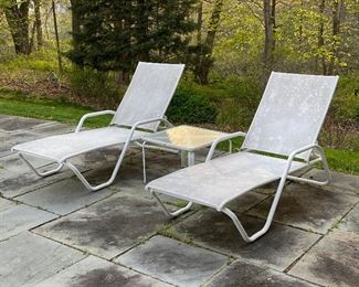 (3pc) PATIO FURNITURE | White outdoor lounge furniture, including a Brown Jordan glass-top side table (marked on the bottom) and two Telescope Casual lounge chairs [worn from outdoor use, need to be cleaned]; table h. 16 x w. 22-1/4 x d. 22-1/4 in., chairs approx. l. 73 x w. 26-1/2 in. 
