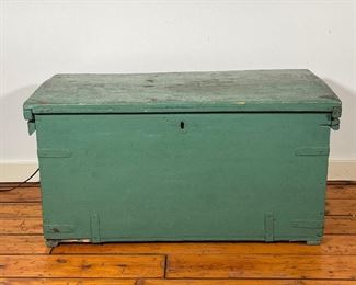 GREEN PAINTED STORAGE CHEST | An early wood chest painted green allover [missing lock hardware]; h. 21 x w. 41 x d. 22 in. 