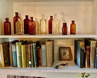 Many Vintage Books and Bottles