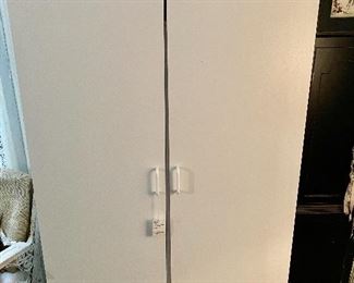 Several White Storage Cabinets