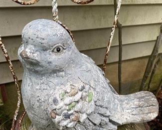 Yard Decor with a purpose: The bird is watching the cat.