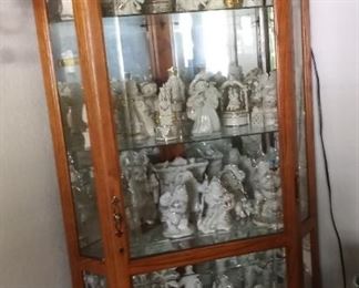 Corner Cabinet Full of Lenox Christmas Figurines 