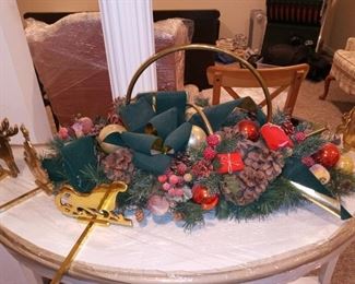 Christmas arrangement and brass stocking holders