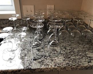 Set of 4 brandy glasses $6 (sold). Set of 4 martini glasses (sold). Set of 7 wine glasses with black swirls $10. Set of 9 wine glasses $10. 