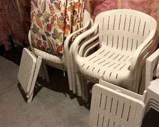 Set of 6 heavy duty white resin chairs with cushions and 2 ottomans $80. 