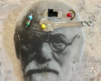 $15 Freud pin with implements.  2.2"L, 1.8"W 