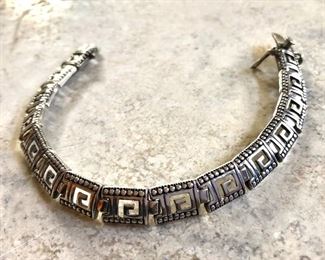 $40 Greek design sterling silver hinged bracelet.  7"L 