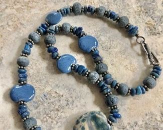 $45 Blue beaded necklace with silver accents.  18"L 