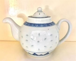 $20 Blue and white rice pattern tea pot 5"H, 7.5" W, 4.5" diam.