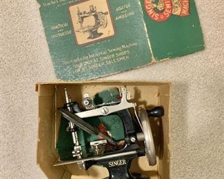 $125 - Antique sewing machine.  7" H, 7" W. 