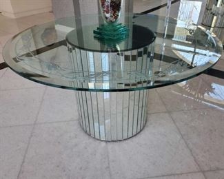 1010	

Round Glass Top Foyer Table with Mirror Base
Measures approx 55" x 30" Vase on top is Not included