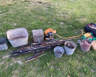 Fishing rods, reels, vintage galvanized buckets.
