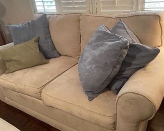 Cream microfiber suede Loveseat with down.
