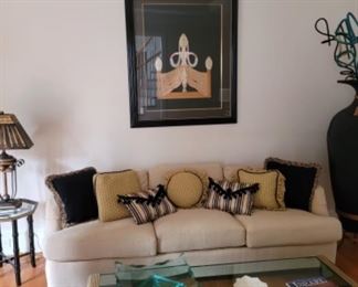 Signed Erte serigraph, custom upholstered couch and decorator pillows 