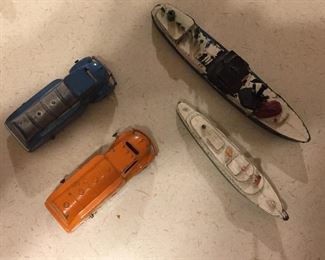 Antique metal toy trucks and boats