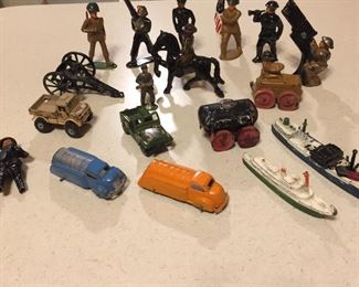 Antique metal soldiers, boats, trucks