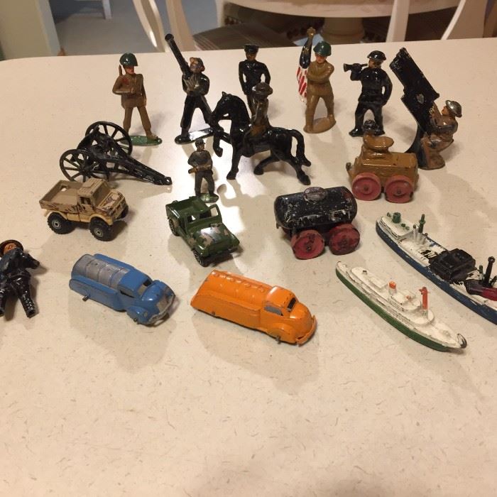 Antique metal soldiers, boats, trucks