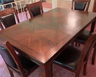 Very nice wood dinner table with six chairs