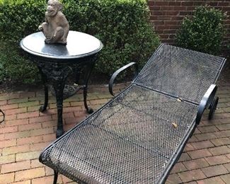 Metal chaise lounger with side wrought iron table