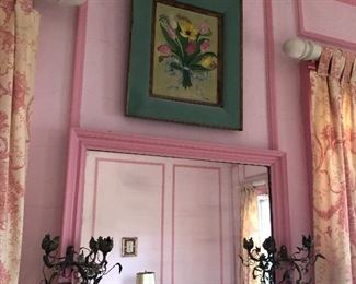 Framed decor and Large mirror with metal sconces