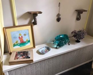 Wall sconces - gilded, watercolor framed, art books, glass "art" formed from Ford Motor Company on iron display stand and more