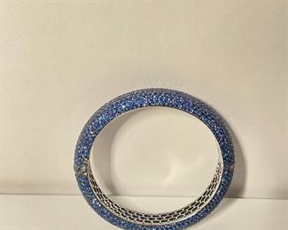 Sapphire and 18k white gold bracelet. Stamped 18k and 750. The bracelet is around three inches at it widest. The inside of the bracelet is around two and three eights inches at its widest. price 4000 dollars.