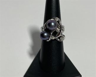 14k White gold ring. Size five and three quarters. Diamonds and real pearls. price 500 dollars.