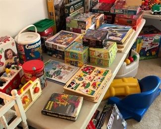 Puzzles and vintage Fisher Price toys