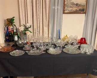 Assorted Crystal Pieces, Pink Depression Glassware, Grape Display with Empty Bottles of Wine in Wrought Iron Stand