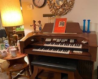 Electric Organ, Sorocco Wall Clock, Cobalt Blue Candlesticks, Lil Girl & Boy Jump Roping, Desk/Organ/Piano Lamp, Brass Table Lamp, Two-Tiered Oak Table, Assorted Porcelain & Fenton Decor'