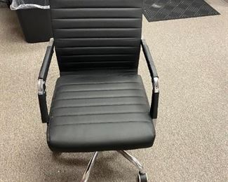sleek office chair- black/trimmed in chrome/adjustable $25