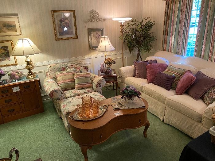 Lovely floral chair & ottoman, white Thomasville couch, the coffee table could also be used against the wall as a table, silk tree, pink cubist pitcher & glass set, lots of purple decor, art, antique floor lamp with a gorgeous top, lamp table with open display area, Eastlake chest with drawers